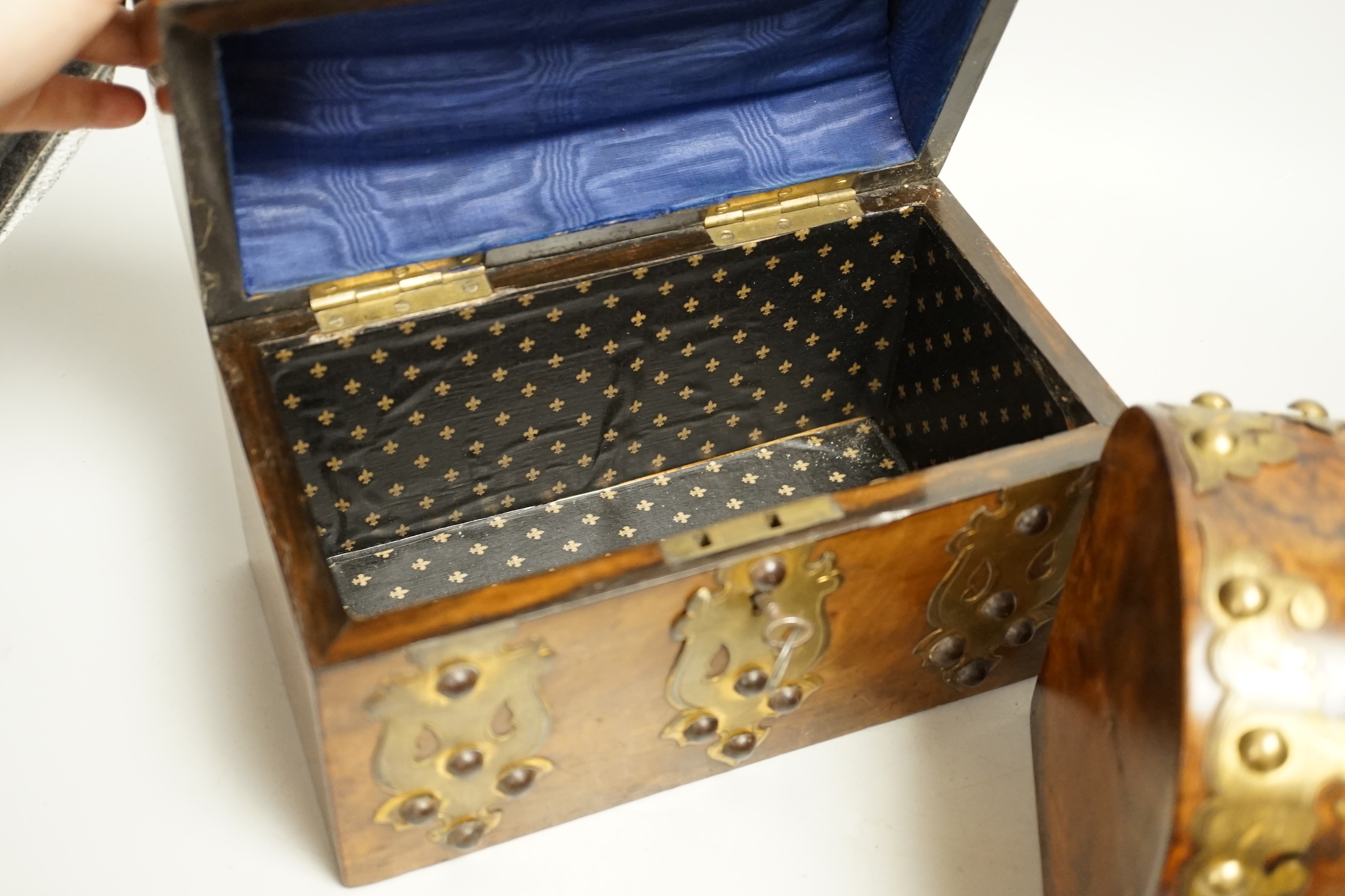 Three Victorian walnut domed topped and brass mounted caskets, largest 23cm wide x 17cm high
